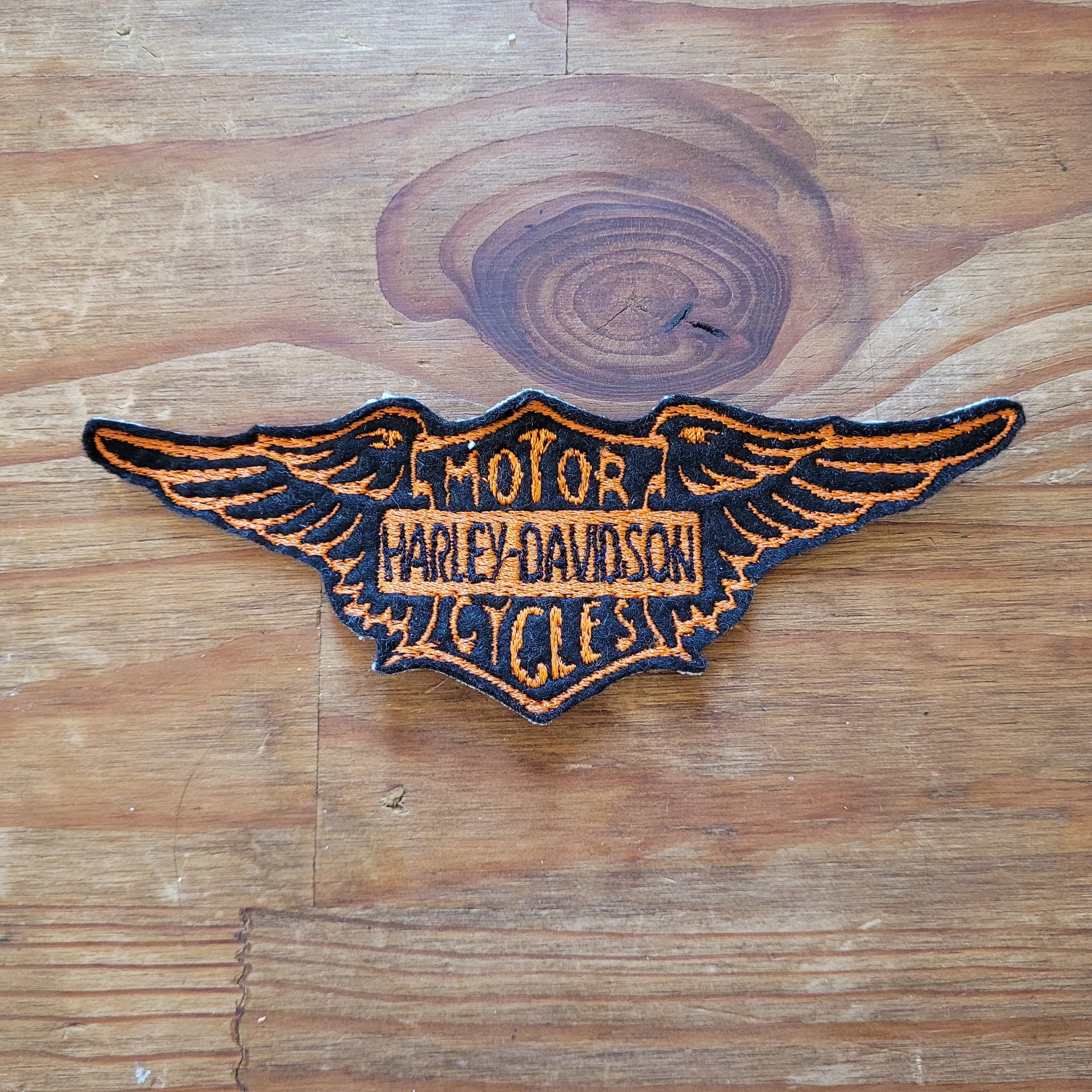 Vintage Harley Wing Logo ( Version Black & Orange)